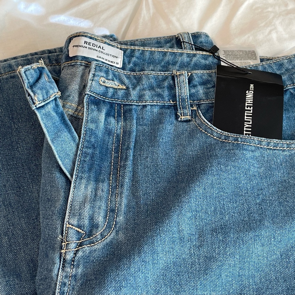 PrettyLittleThing straight let mid wash jeans.